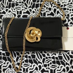 Ted Baker Glossy Black Clutch with Gold Chain With Stunning Closure Flower